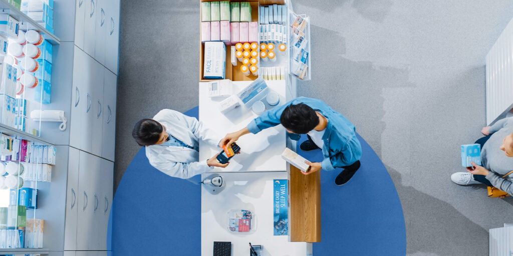 Man making a purchase at a pharmacy