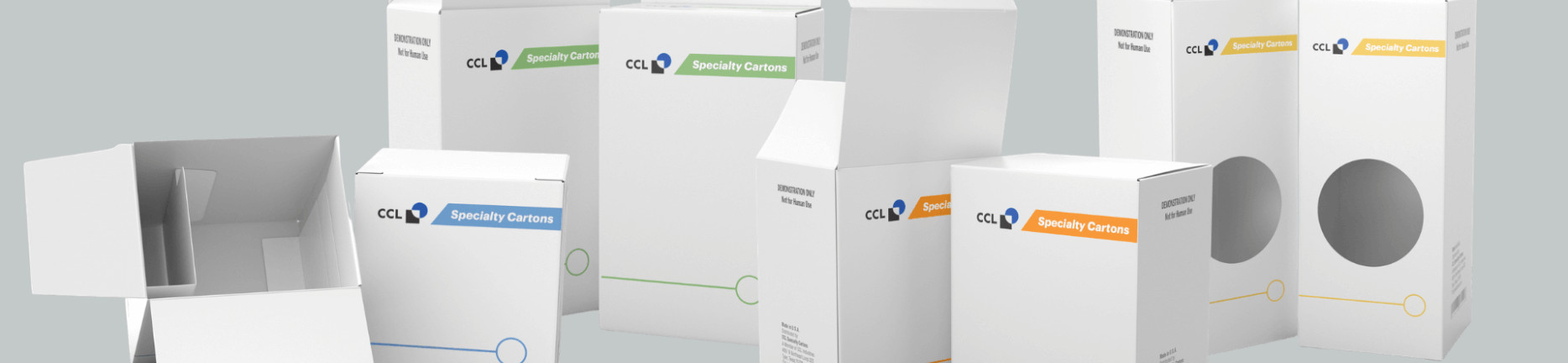 CCL specialty cartons with different colored labels of blue, green, orange, and yellow